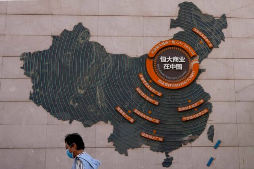 chinese police detain wealth management staff at the heavily indebted developer evergrande