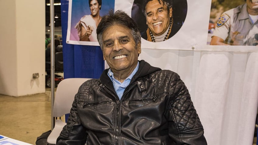 erik estrada sitting at table