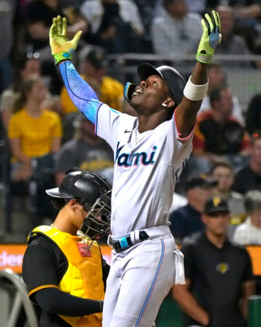 chisholm homers and the surprising miami marlins grab an nl wild card spot with 7 3 win over pirates