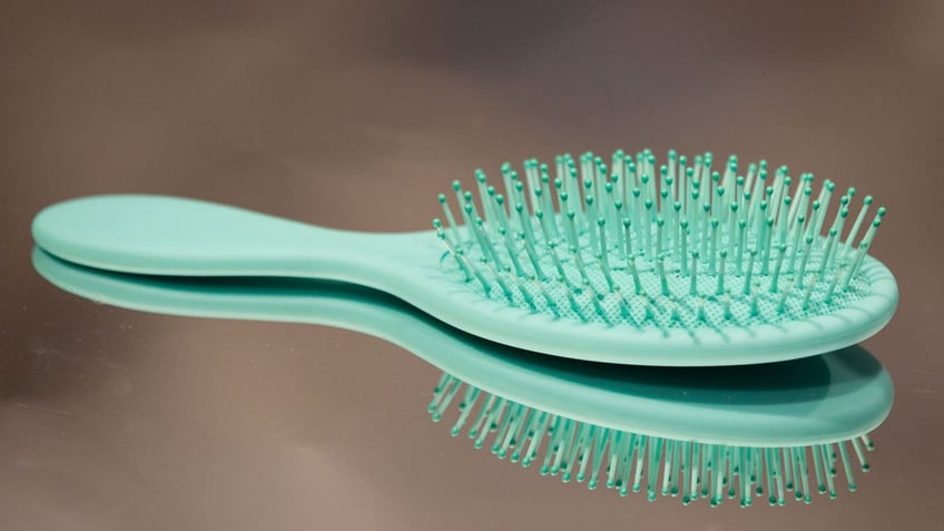 A cushion paddle brush