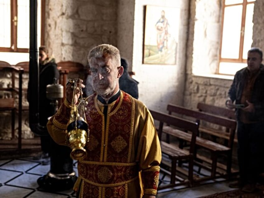 ESAD REJIMINI'NIN YIKILMASININ ARDINDAN SURIYELI HRISTIYANLAR, ILK PAZAR AYININI YAPTI. SA
