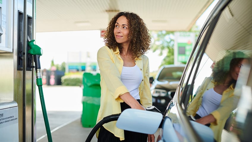 woman at gas pump