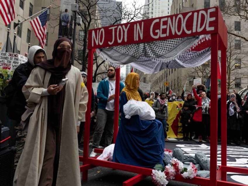 NEW YORK, NY - DECEMBER 25: Pro-Palestinian demonstrators demand that Christmas not be celebrated during Israel's continued bombing of the Gaza Strip on Christmas Day on December 25, 2023 in New York City. (Photo by Andrew Lichtenstein/Corbis via Getty Images)