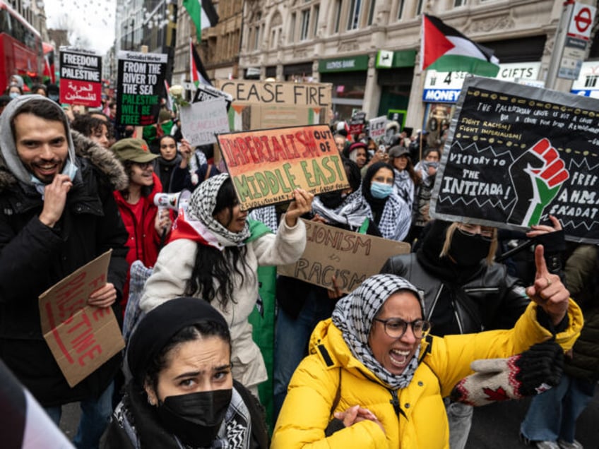 LONDON, ENGLAND - DECEMBER 23: A march called by Sisters Uncut calling for a ceasefire and Palestinian freedom proceeds down Oxford street on December 23, 2023 in London, England. (Photo by Guy Smallman/Getty Images)