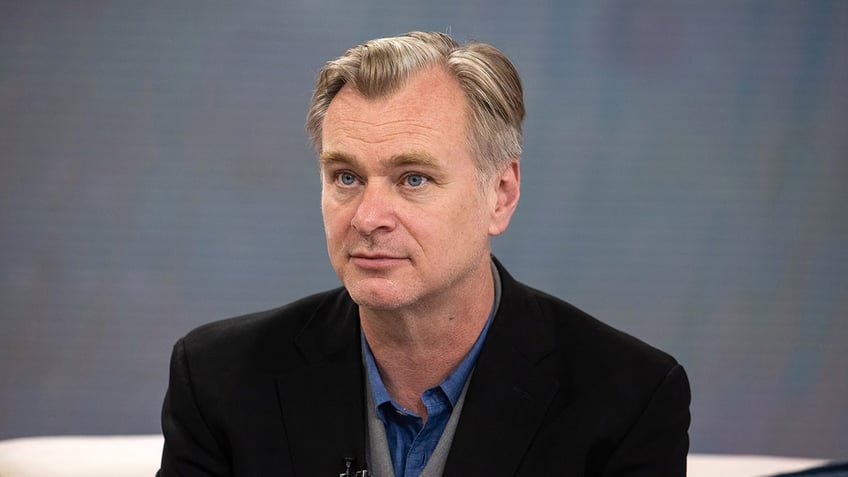 Close up of Christopher Nolan sitting