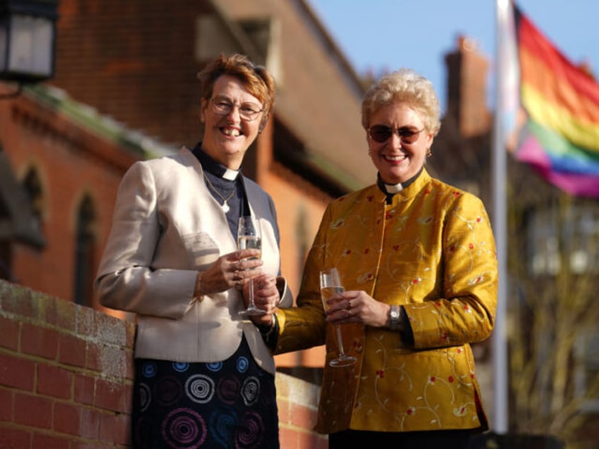 Catherine Bond (right) and Jane Pearce following being blessed at St John the Baptist church in Felixstowe, Suffolk, after the use of prayers of blessing for same-sex couples in Church of England services were approved by the House of Bishops. Picture date: Sunday December 17, 2023. (Photo by Joe Giddens/PA …