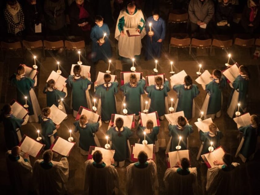 SALISBURY, ENGLAND - DECEMBER 01: Candles are carried by choristers during the annual 'dar