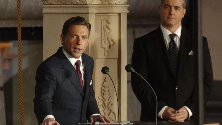 David Miscavige talks at a podium