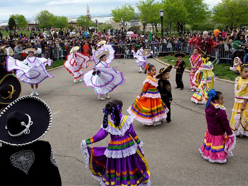 NEW YORK, NY - MAY 7: Children in traditional dress gather for Cinco de Mayo festivities i
