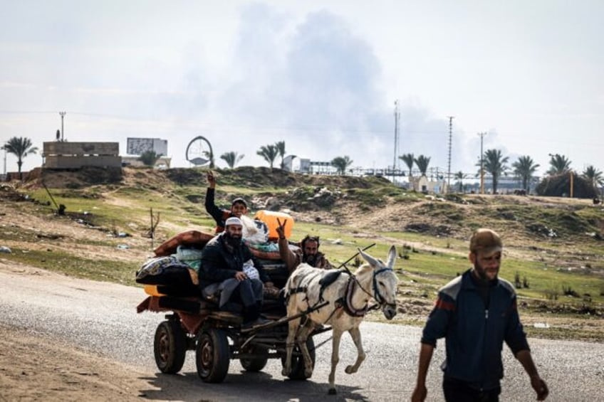 Palestinians flee Khan Yunis toward Rafah further south in the Gaza Strip as Israel bombards the city