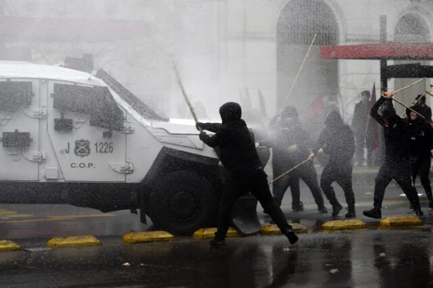 clashes arson mar chile march to commemorate pinochet victims