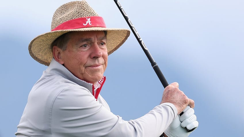 Nick Saban plays golf