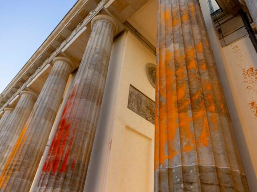 cleaning of green extremist graffiti on historic brandenburg gate to be more difficult expensive than feared