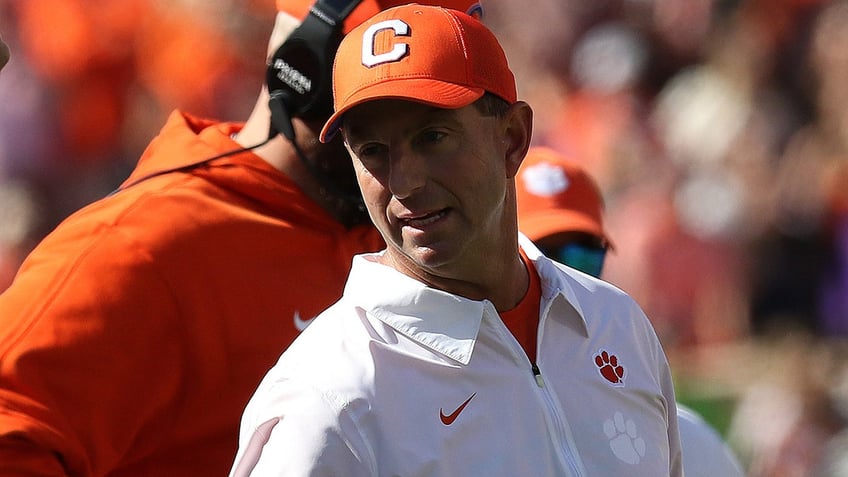 clemsons dabo swinney implores fans to buy stock in them after upset win over notre dame