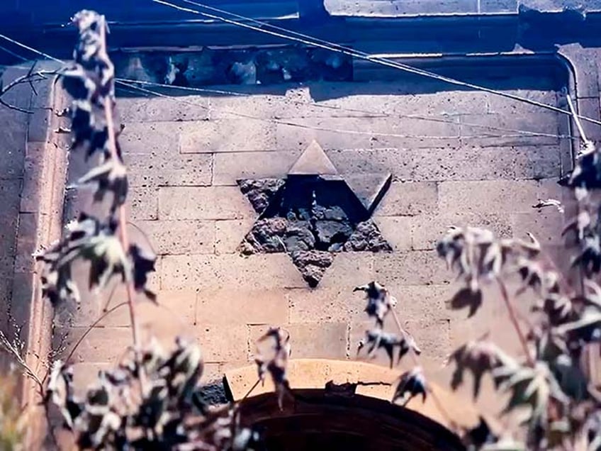 In this photo taken from video released by The Telegram Channel of the head of Dagestan Republic of Russia on Monday, June 24, 2024, a damaged Star of David is seen on the wall of the the Kele-Numaz synagogue in Derbent after a counter-terrorist operation in republic of Dagestan, Russia. Multiple police officers and several civilians, including an Orthodox priest, were killed by armed militants in Russia's southern republic of Dagestan on Sunday, its governor Sergei Melikov said in a video statement early Monday. (The Telegram Channel of the head of Dagestan Republic of Russia via AP)