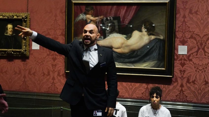 climate activists take hammers to famous painting in london museum