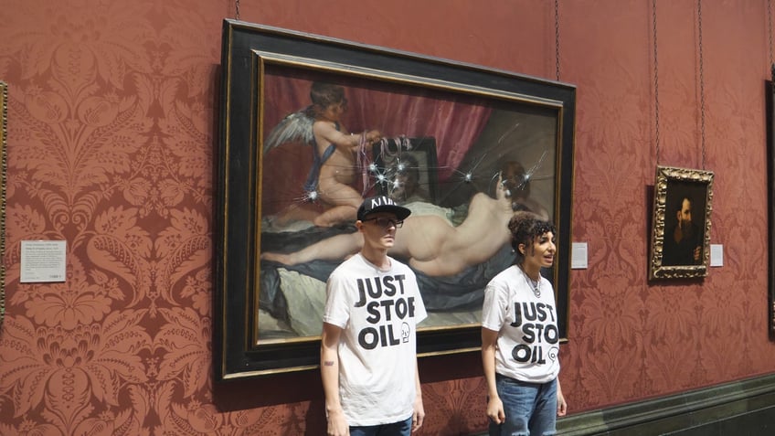 climate activists take hammers to famous painting in london museum