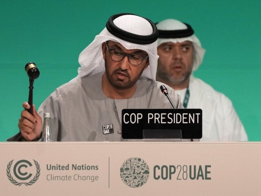 COP28 President Sultan al-Jaber bangs the gavel during a plenary session at the COP28 U.N. Climate Summit, Wednesday, Dec. 13, 2023, in Dubai, United Arab Emirates. (Kamran Jebreili/AP)