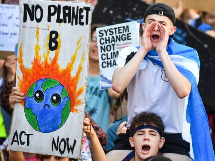 EDINBURGH, SCOTLAND - SEPTEMBER 20: Protesters march and hold placards as they attend the Global Climate Strike on September 20, 2019 in Edinburgh, Scotland. Millions of people are taking to the streets around the world to take part in protests inspired by the teenage Swedish activist Greta Thunberg. Students are …