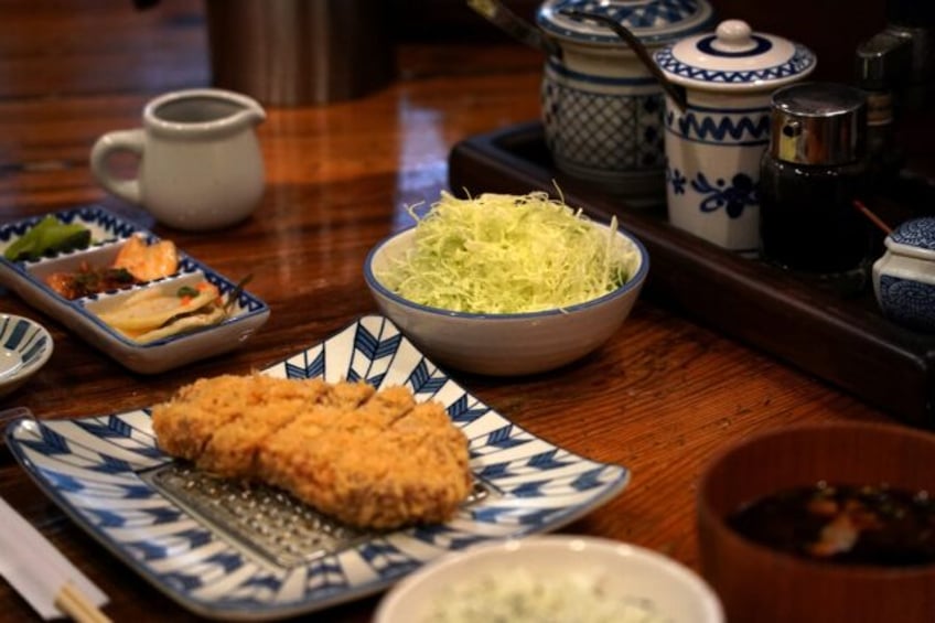 Japan's much-loved 'tonkatsu' pork cutlets come with a mound of freshly shredded cabbage,