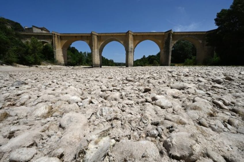 (FILES) A photograph shows the parched river bed of the Gardon near the Saint-Nicolas de C