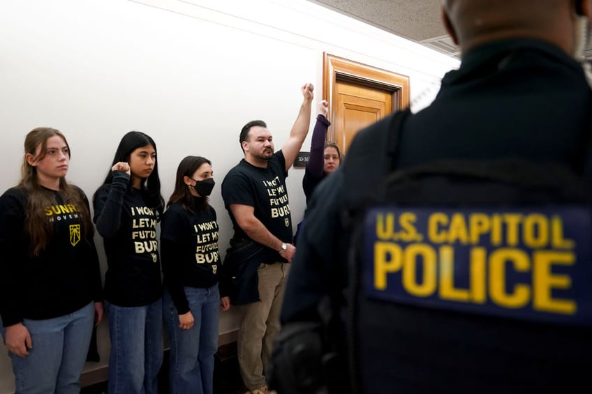 climate protesters disrupt confirmation hearing for trumps energy secretary pick