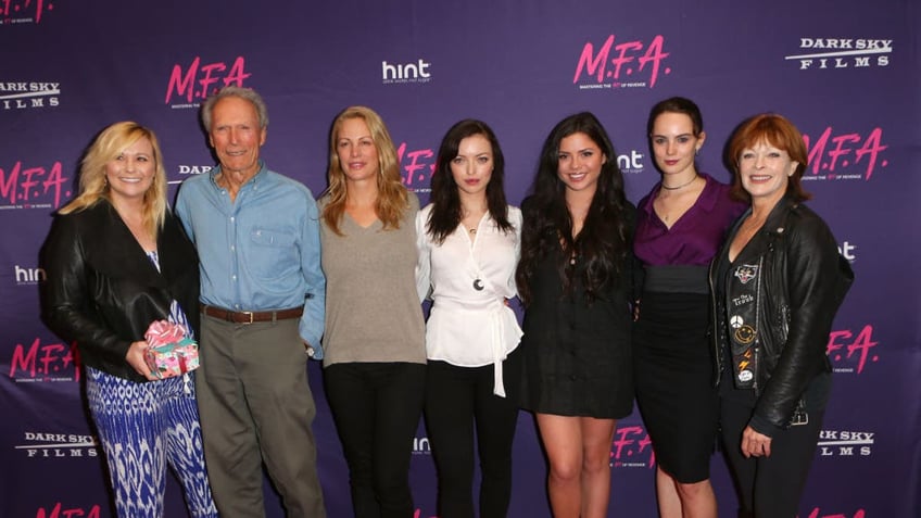 Clint Eastwood walks the red carpet with his children