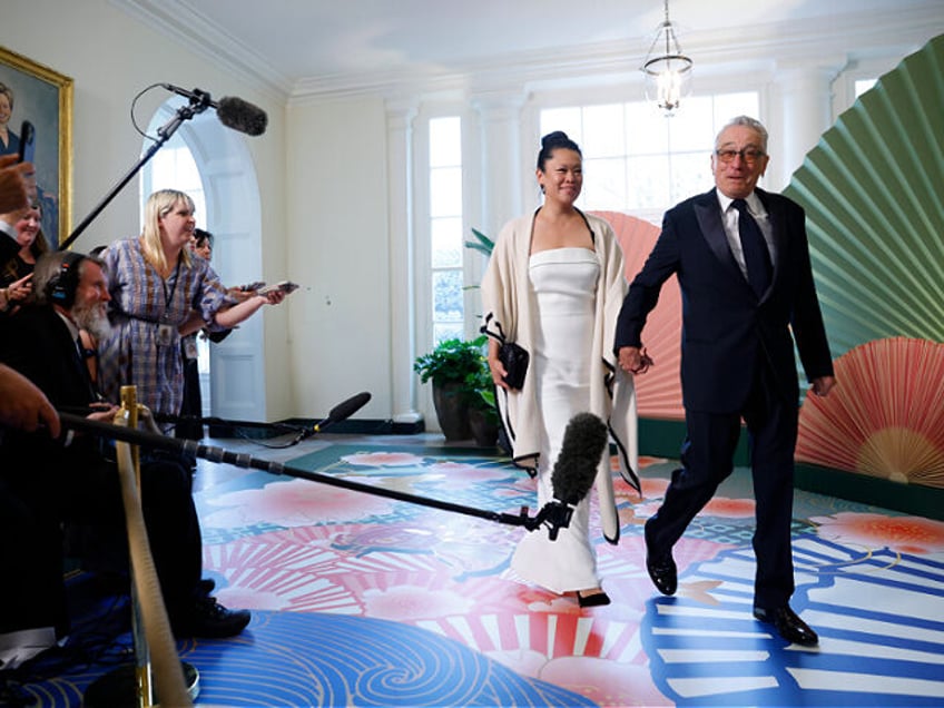 Actor Robert De Niro, right, and Tiffany Chen arrive to attend a state dinner in honor of