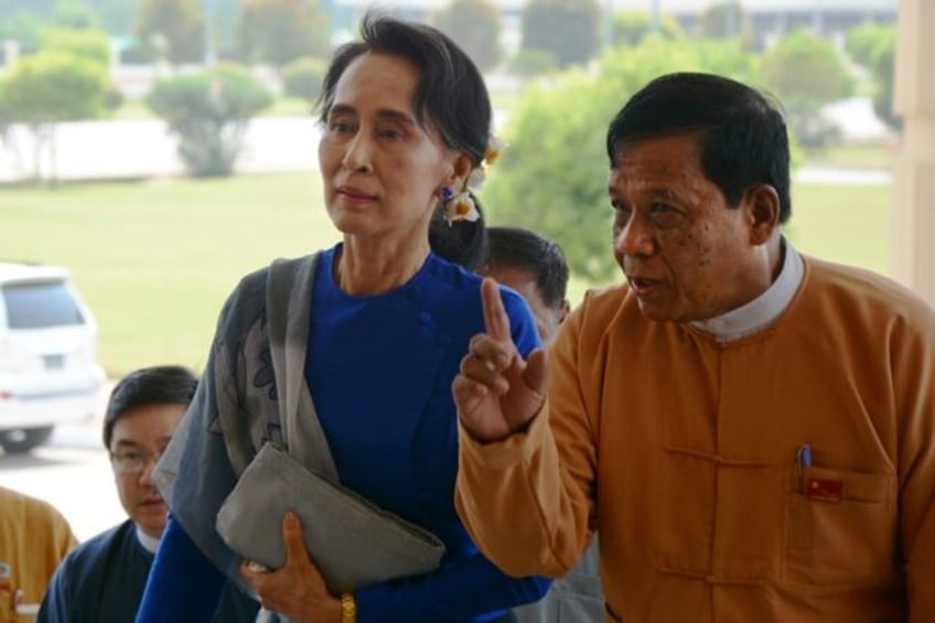 Zaw Myint Maung (R), 72, was a stalwart of Aung San Suu Kyi's (L) National League for Demo