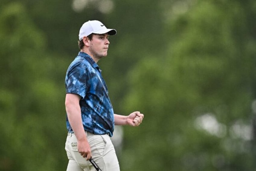 Scotland's Robert MacIntyre reacts to an eagle putt at the par-5 17th hole that helped giv