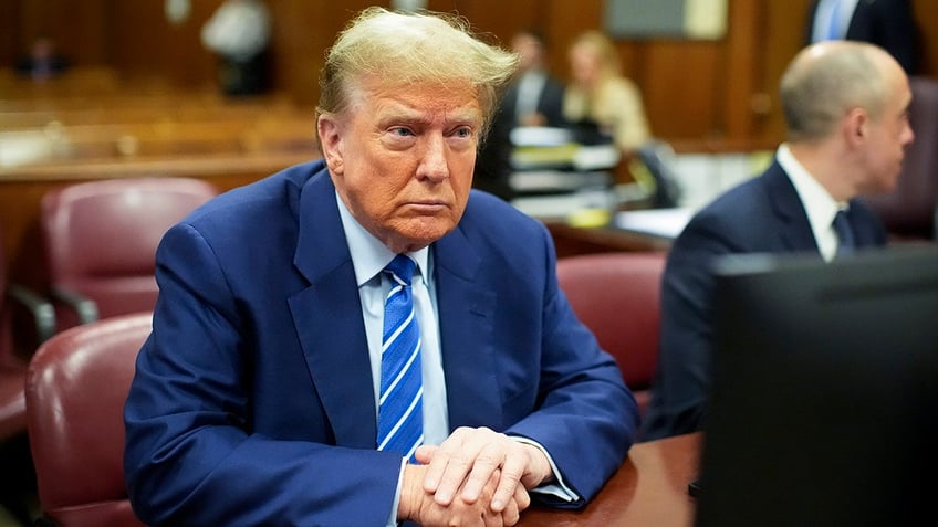 Former President Donald Trump awaits the start of proceedings on the second day of jury selection at Manhattan criminal court