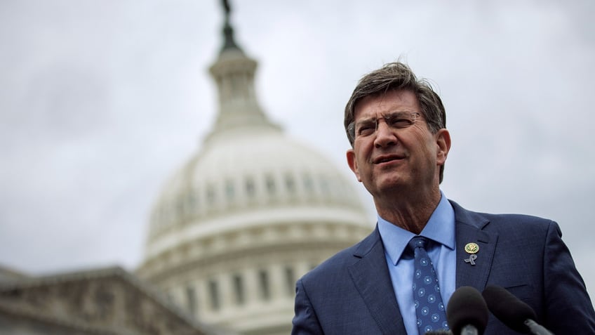 Illinois Rep. Brad Schneider stands in front of the U.S. Capitol building.