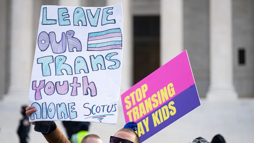 Activists for and against trans rights protest outside the U.S. Supreme Court before the start of the United States v. Skrmetti case on Wednesday, December 4, 2024.