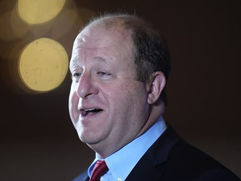 Colorado Gov. Jared Polis speaks during an interview at the 2024 summer meeting of the Nat