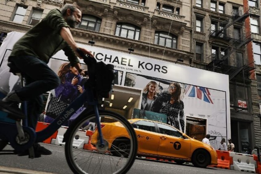 coach owner to acquire michael kors versace parent in 85bn deal