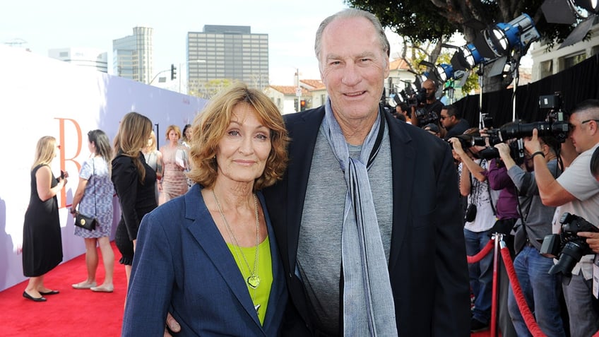 Doria Cook-Nelson and Craig T. Nelson posing together on the red carpet