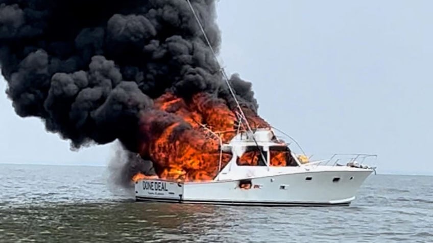 coast guard rescues 2 men from capsized boat in georgia