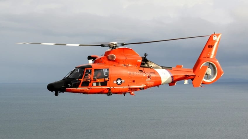 coast guard searching for woman swept by current off beach in washington