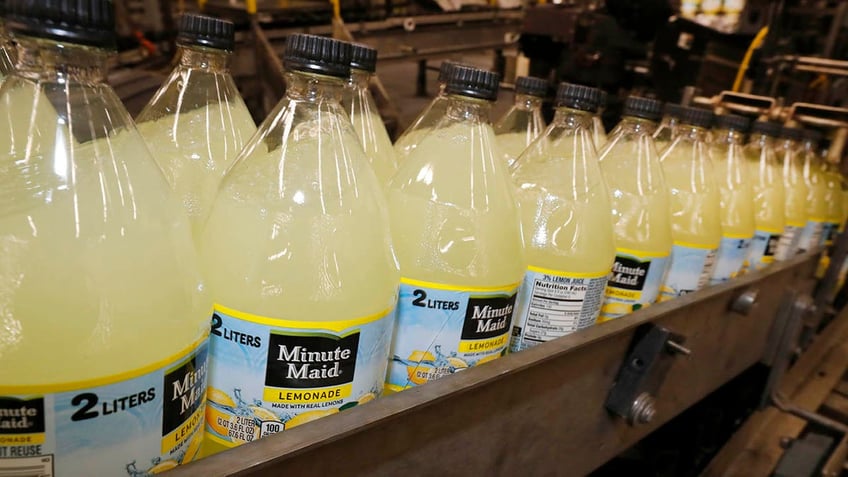 Bottles of minute maid in a factory. 