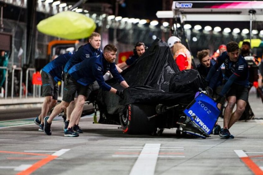 Cleared to race: Franco Colapinto's Williams being cleared away after crashing in qualifyi