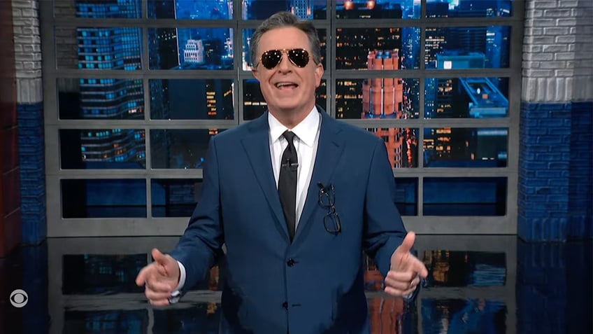 colbert makes grim reaper joke about biden for his birthday standing silently in my doorway