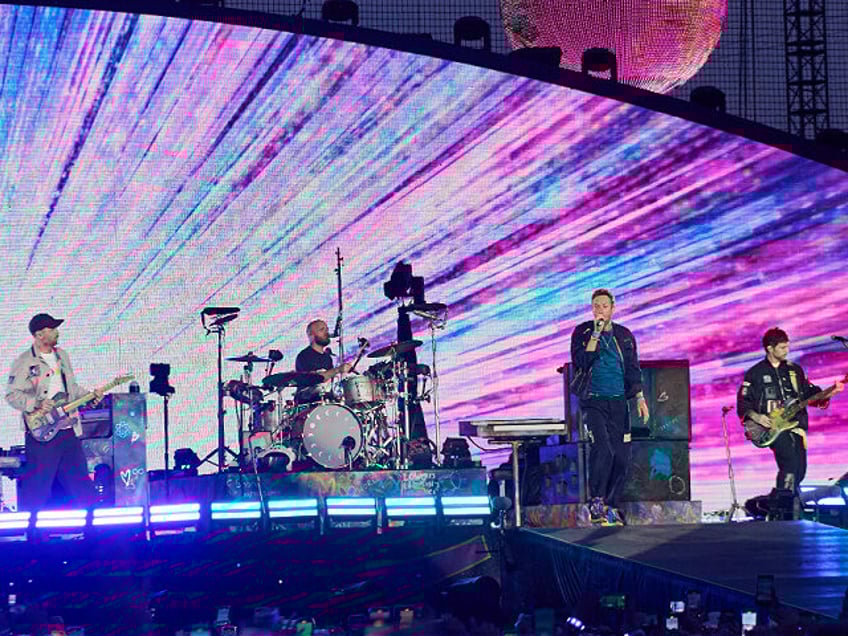 TORONTO, ONTARIO - JULY 07: (L-R) Jonny Buckland, Will Champion, Chris Martin and Guy Berr