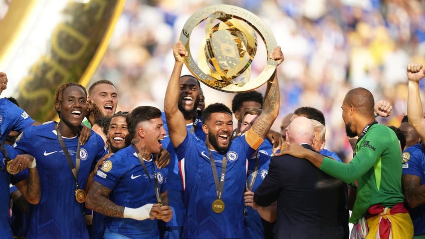 Chelsea captain Reese James lifts the FIFA Club World Cup trophy after the team's win over PSG. (Photo by Jose Breton/Pics Action/NurPhoto via Getty Images)