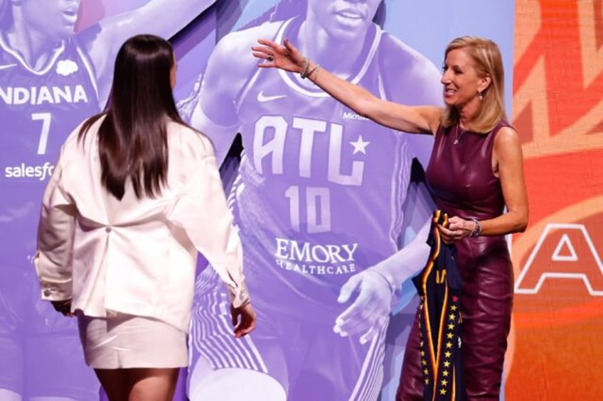 WNBA Commissioner Cathy Engelbert congratulates Caitlin Clark, who was selected first over