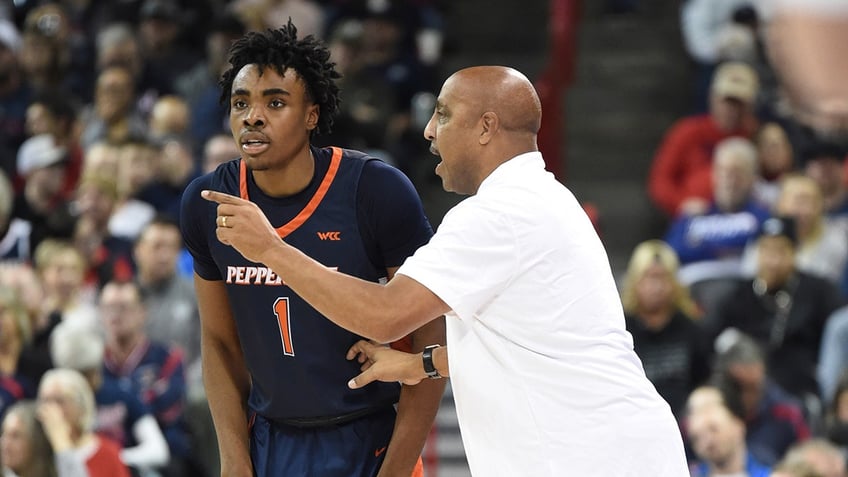 Lorenzo Romar talks to Michael Ajayi