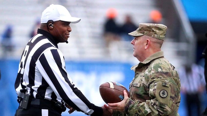 Rory Bernard shakes hand with Tennessee National Guard