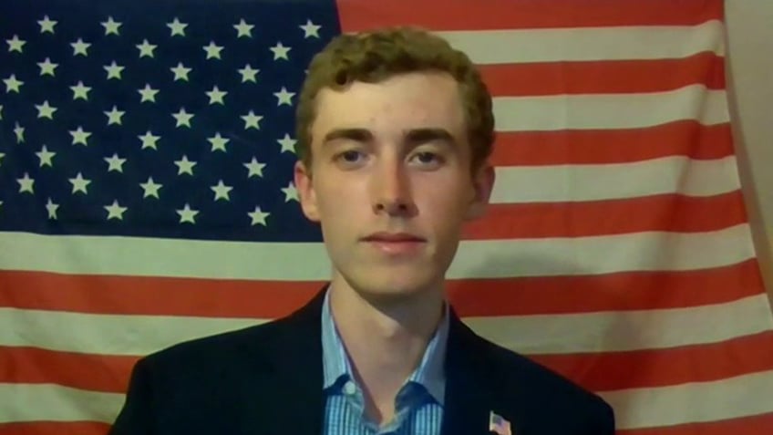 21-year-old Wyatt Gable in front of U.S. flag