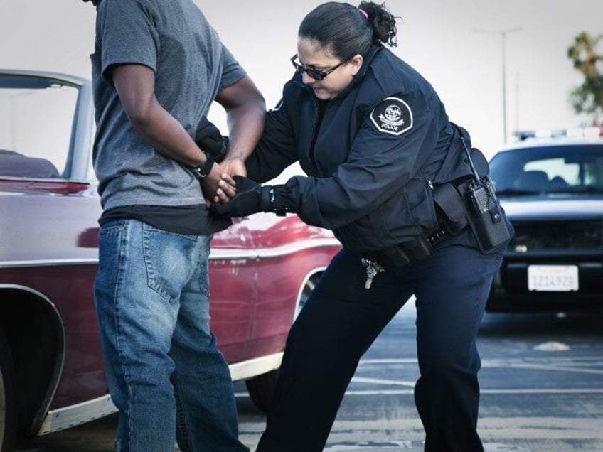 woman handcuffing man