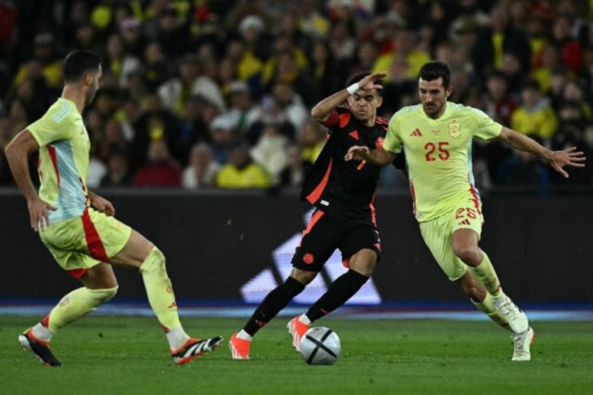 Colombia and Liverpool winger Luis Diaz (C) impressed in his team's win over Spain at the