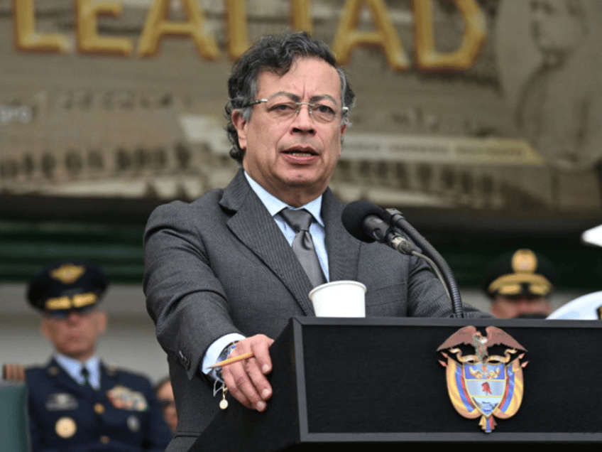 Colombia's President Gustavo Petro delivers a speech in front of Colombia's new Minister o